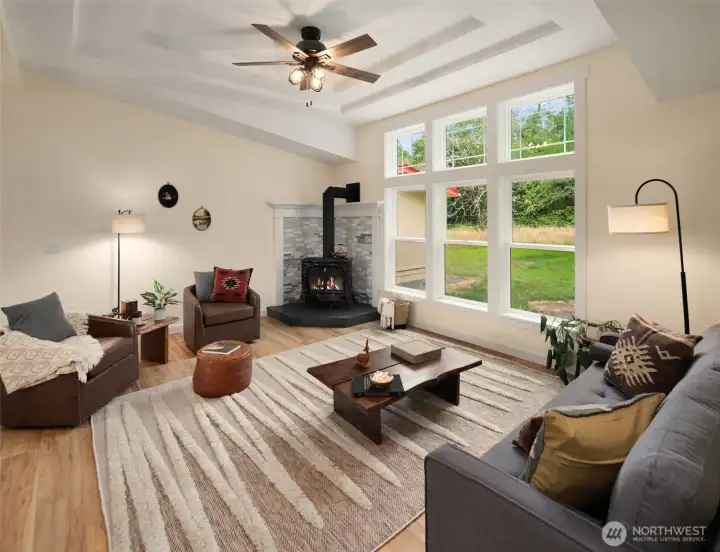 The living room has great light and a gas stove for cozy nights. The living room has great light and a gas stove for cozy nights.