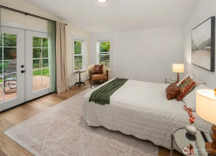 Large primary bedroom has a private deck. Large primary bedroom has a private deck.