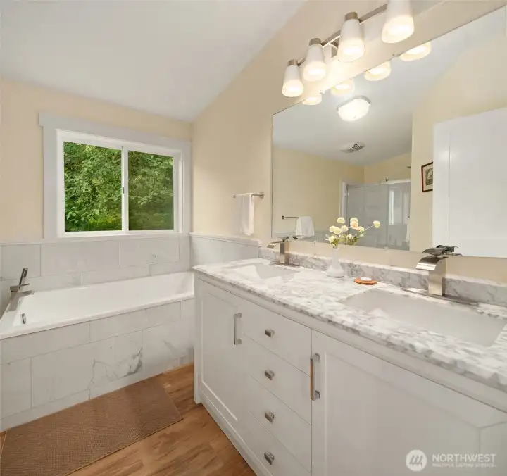 Primary bathroom of the manufactured home has a seperate tub, show and marble countertops Primary bathroom of the manufactured home has a seperate tub, show and marble countertops