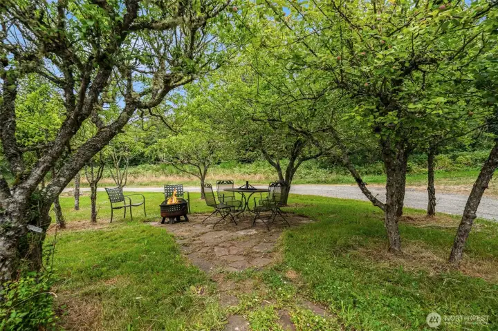Apple and fruit trees surround a sweet outdoor space near the main home and the apartment. Apple and fruit trees surround a sweet outdoor space near the main home and the apartment.