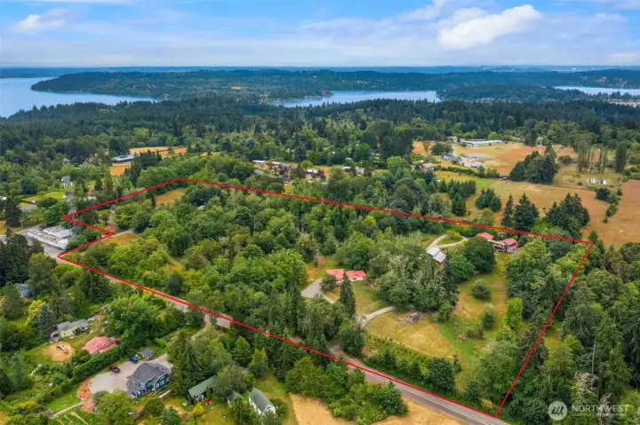 Aerial shot facing south/southeast (boundary lines are aprox) shows the full lay out of the property. You can see how the main home is set on the southern section of property. The manufacture home has trees around it for privacy. Aerial shot facing south/southeast (boundary lines are aprox) shows the full lay out of the property. You can see how the main home is set on the southern section of property. The manufacture home has trees around it for privacy.