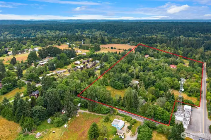 Aerial shot facing west. Eastern border is Vashon Hwy. The 1888 Farm house and Fleece storage workshop just to the south of the communication tower. Aerial shot facing west. Eastern border is Vashon Hwy. The 1888 Farm house and Fleece storage workshop just to the south of the communication tower.