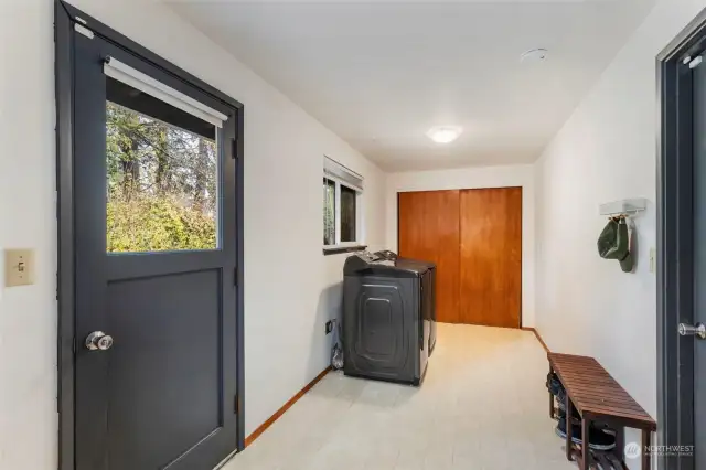 Massive Utility Room with closet and a door to the back patio and yard.