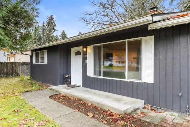 New front door, double paned windows and large front patio make for a warm and inviting approach