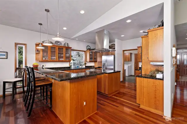 Custom throughout - from the American Cherry custom cabinets, Granite countertops and stainless appliances - this kitchen satisfies even the most discerning culinary enthusiast!