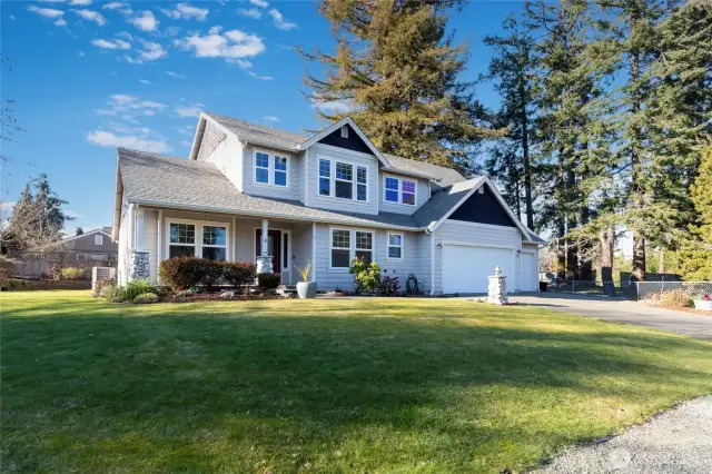 Angled front view from the street of this amazing Steilacoom house.Large Private Corner lot just steps from Salter Point Park and the beautiful Puget Sound.