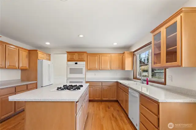 Another view of the kitchen with tons of cabinet and counter space.Double ovens for the true Chef.