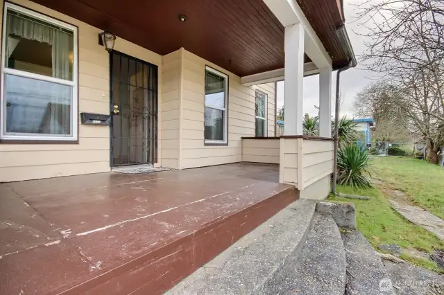 Step onto the large covered front porch overlooking Angel Place.