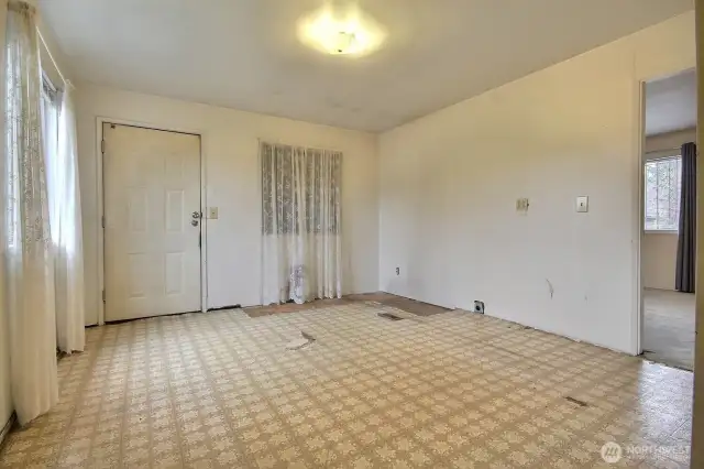 Family/flexroom has access into the home from the garage. Main floor bedroom can be seen on your right.