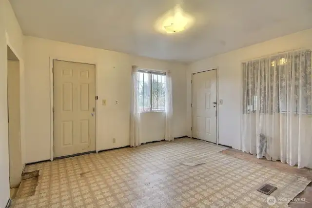 Light-filled family/flexroom with access to the deck on the north side of the home.