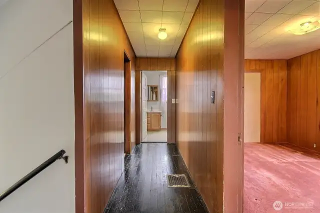2nd floor hallway leads to 2 additional bedrooms and full bath at the end of the hall.