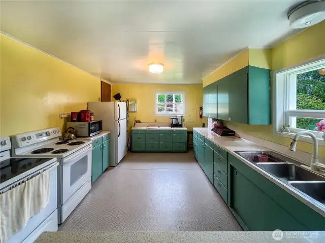 A large kitchen, designed to accommodate events, social gatherings, cooking classes, and everyday meal preparation