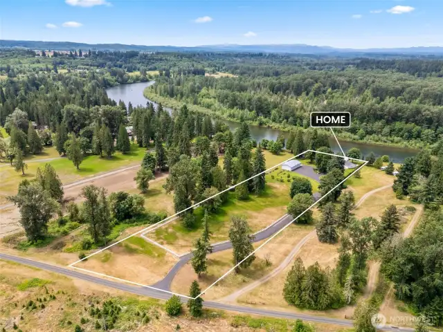 A view looking West at property from high over Green Water Dr