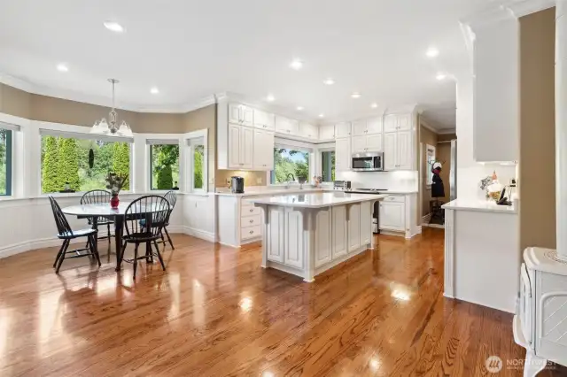 Kitchen area with breakfast nook dining area looking out to backyard and river