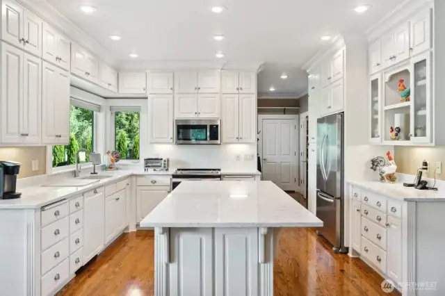 Full compliment of upper and lower cabinets. Pantry and mud room beyond Refrigerator