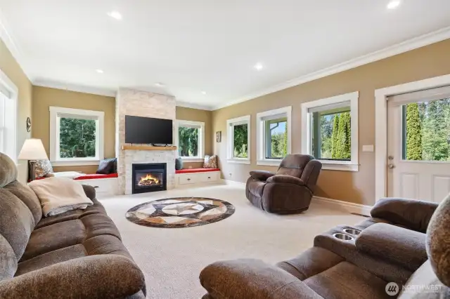 Spacious family room with windows to the beautiful vies and gas fireplace for clean and cozy warmth.