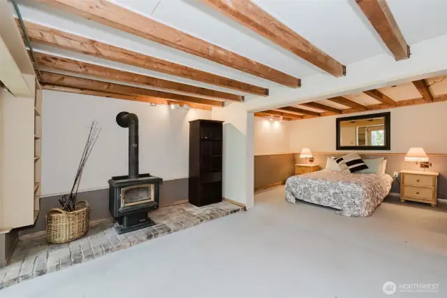 Downstairs bedroom w/ wood burning fireplace