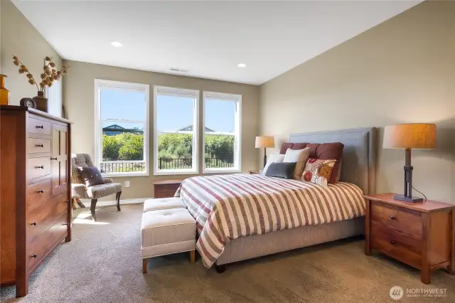 Perfect primary is tucked away in the back of the home nearest the permanent greenbelt - nice, quiet and private.