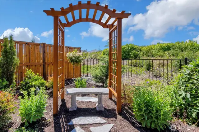 Your own private park bench surrounded by lavish, professionally designed landscaping.