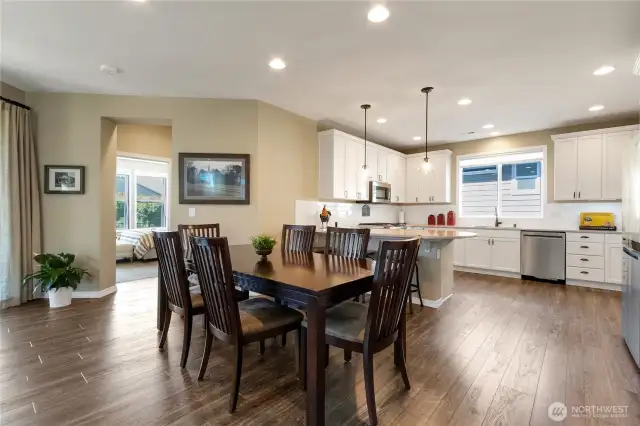 Open concept living at its finest! This is a large table and the space accommodates a table-leaf and 8-10 chairs comfortably.