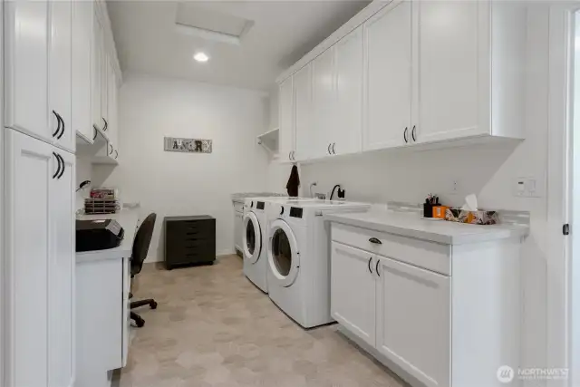 Super functional smart office and laundry area. Great mud-room function, too! HUGE. Tall cabinetry. Very nice. PLEASE NOTE: W&D will be different model.