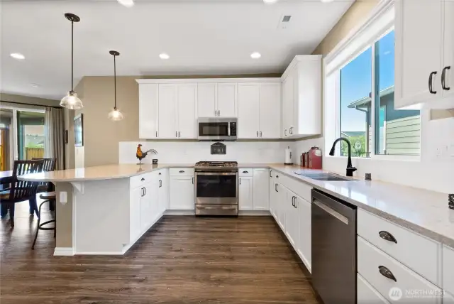 Kitchen shines with pride of stainless appliances including gas stove, undermount sink, slow-close cabinetry and pull-out drawers, too. Not shown is a lovely cofee / beverage niche and pantry.