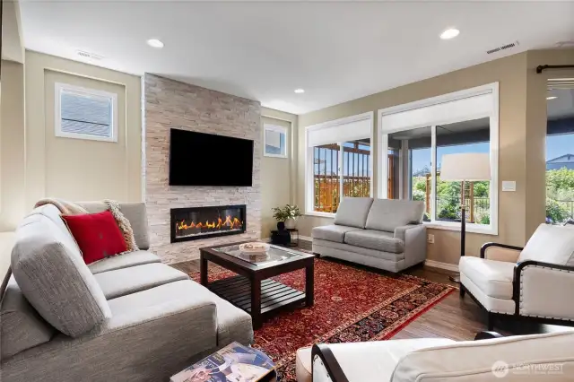 Seller added this electric fireplace with cut-stone beauty surrounding. You'll love the space and its ambiance.