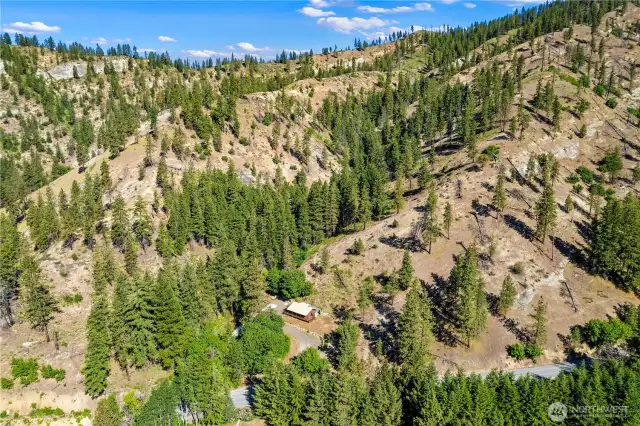 Aerial view of home, land, and surrounding properties