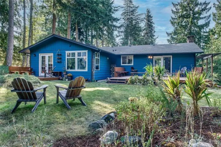 Super private backyard features two decks and plenty of space for relaxation
