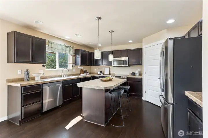 Large kitchen with island and includes all appliances.