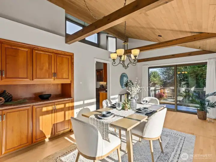 A formal dining space immediately to your right is illuminated by clerestory windows. A built-in buffet provides great storage for your celebratory dinnerware.