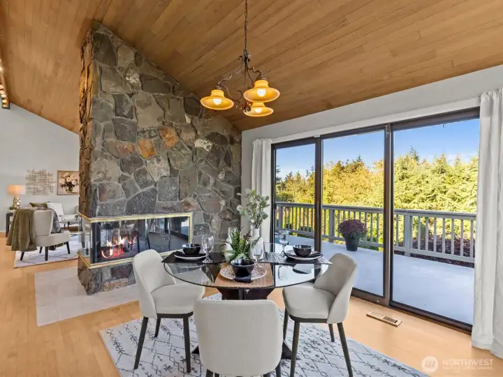 Accented by a stone fireplace, you're sure to keep nice and cozy during the cooler months. Electric exterior shades on the sliding doors are an added luxury.