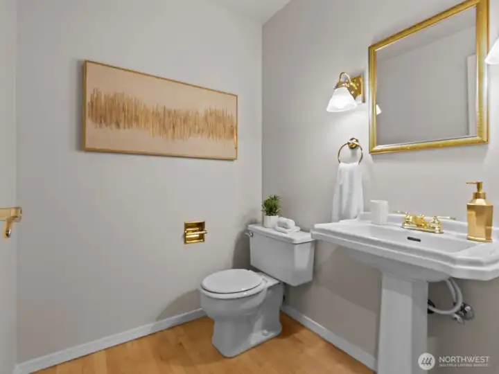 Just down the hall is the conveniently located 1/2 bathroom. Adjacent you'll find the laundry room.