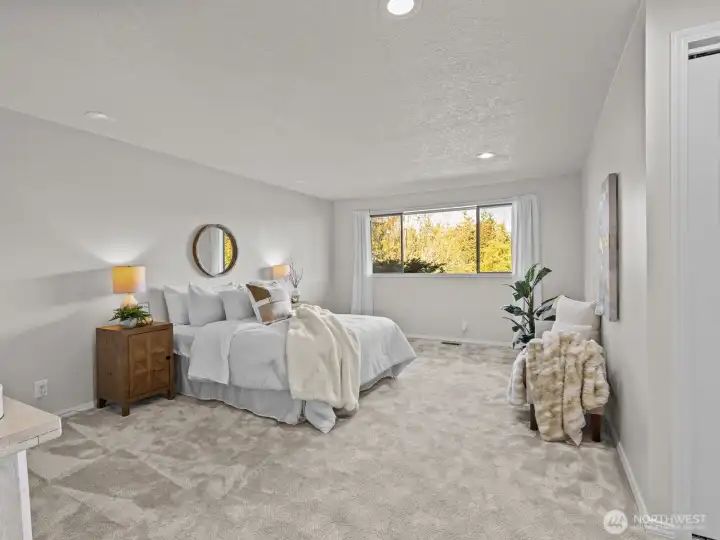 Rounding out the main floor is the roomy primary suite where you'll overlook the private backyard.