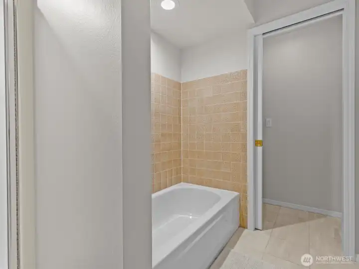 An oversized double vanity leads you into the bathroom with separate tub and shower with water closet for additional privacy.