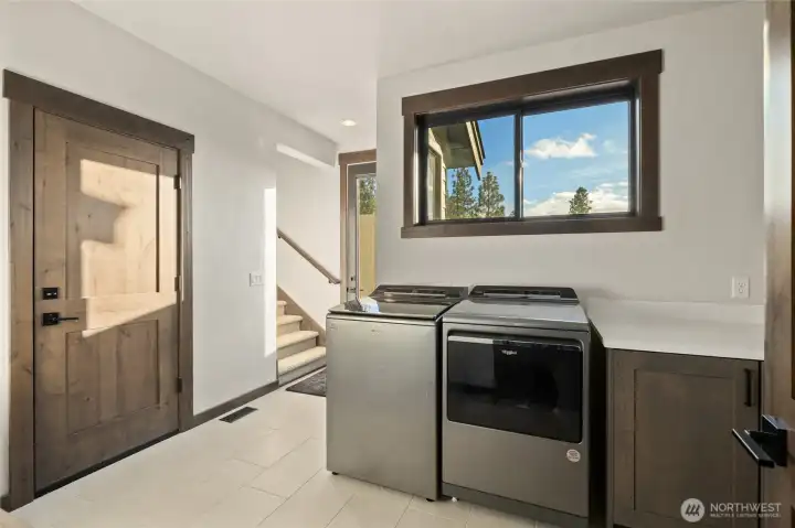 Laundry and mud room with exterior door and garage access