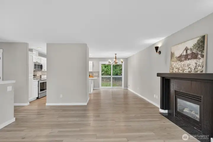 Adjacent to the kitchen, this dining area opens directly to the back deck—ideal for indoor-outdoor entertaining.