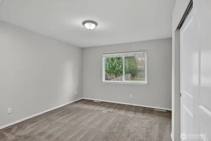Relax in your generous primary bedroom complete with ample closet space and an attached bathroom for added convenience.