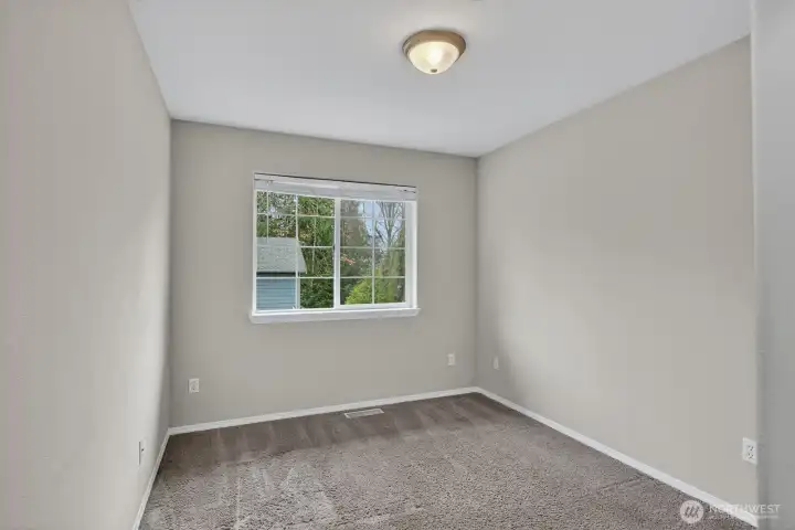 Guest Bedroom 1: Comfortable upstairs bedroom with great natural light and ample closet space—perfect for family, guests, or a home office.