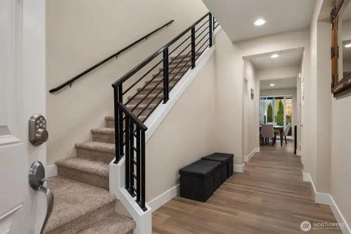 Grand entry with new flooring and carpet throughout the entire home.