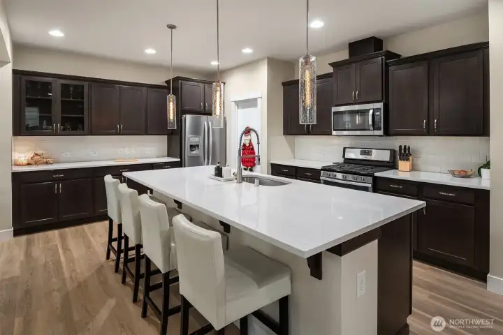 Beautiful modern kitchen with gas cooktop, open concept for easy entertaining.