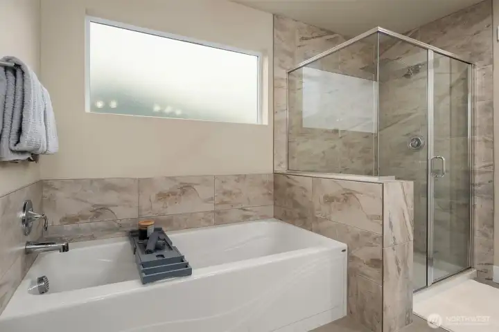 Large soaking tub for those bubble bath days. Walk in shower.