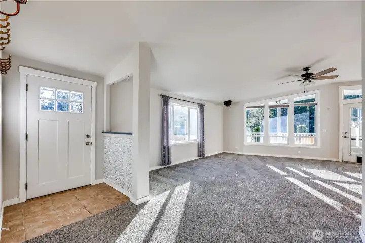 As you enter, first look at the south facing wall of windows to the right.