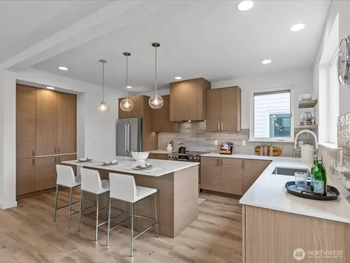 Cook & craft to your heart's content in this well-designed kitchen with island! Model home.