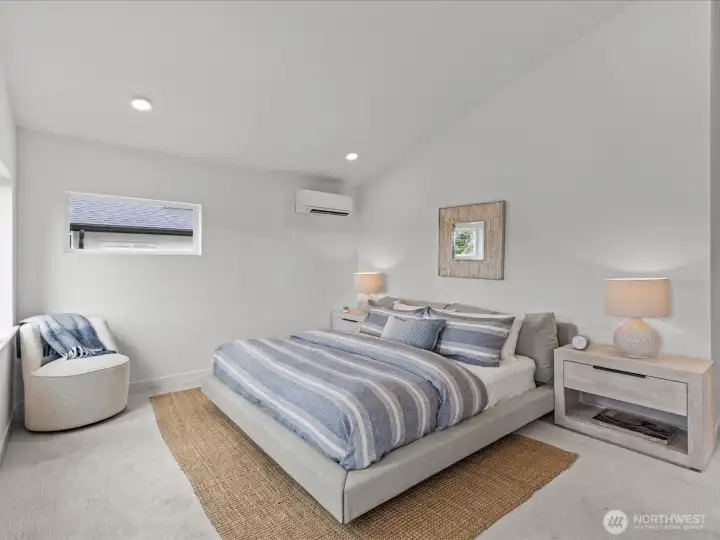 The sumptuous primary suite with soaring vaulted ceilings! Model home.