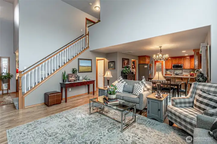 Living room flows into kitchen with dining area