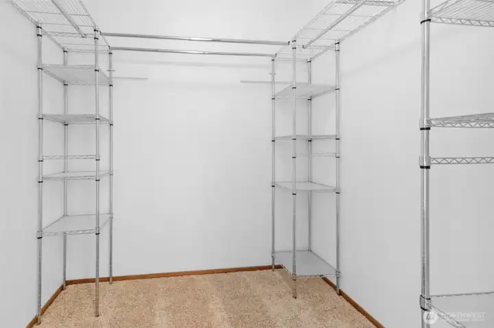 Generous walk in closet in primary Generous walk in closet in primary