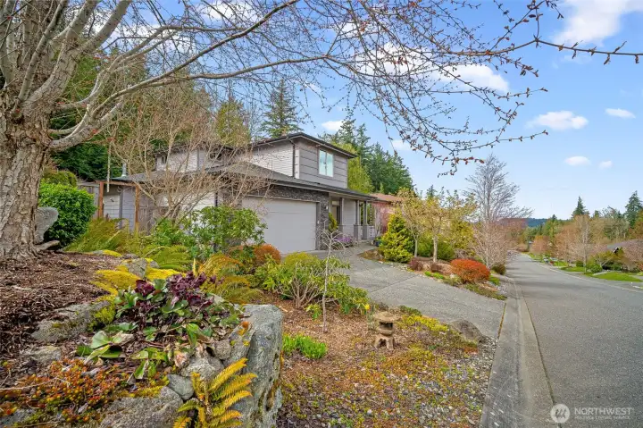 Set along quiet tree lined street, home blends seamlessly into natural surroundings offering a sense of privacy from the moment you arrive.