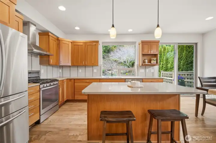 Central island anchors the kitchen, offering generous workspace and a natural place for casual seating and conversation.