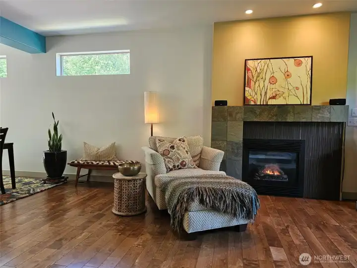 enjoy the custom fireplace while sitting in the spacious living room